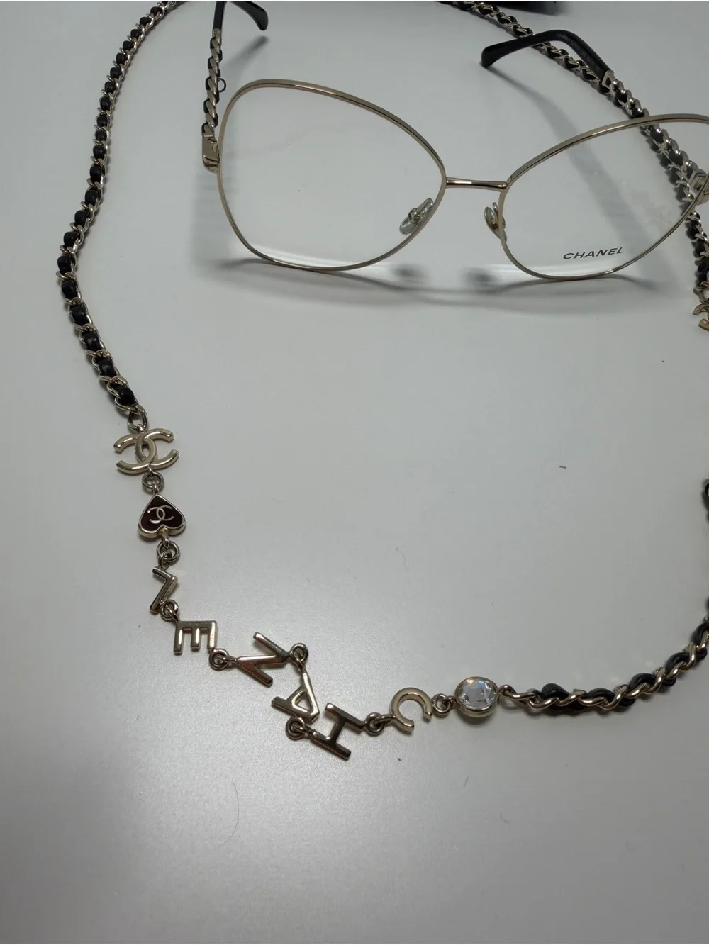 CHANEL  Gold and Black Eye ear Chain with Silver-Tone Glasses